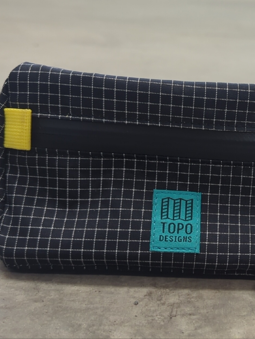 Topo Designs Navy Grid Pouch with Yellow Tab and Teal Logo